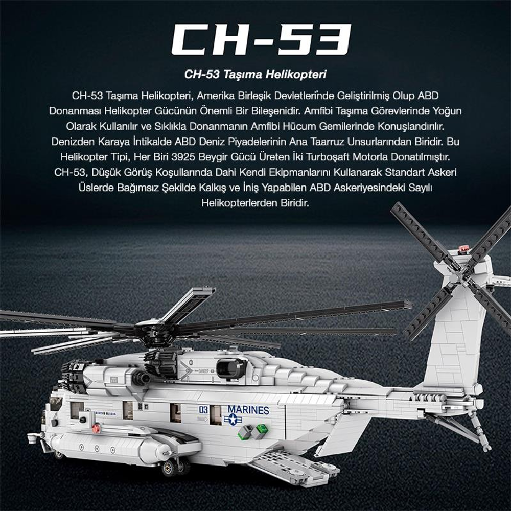 Üzerinde 'MARINES' yazan beyaz bir CH-53 nakliye helikopteri modeli karanlık zeminde duruyor.