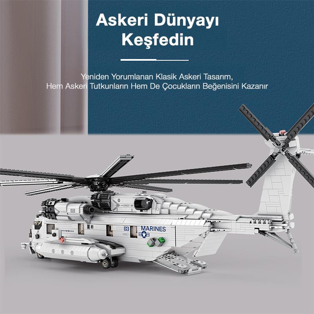 Üzerinde "MARINES" yazan beyaz bir Lego helikopter modeli öndedir.