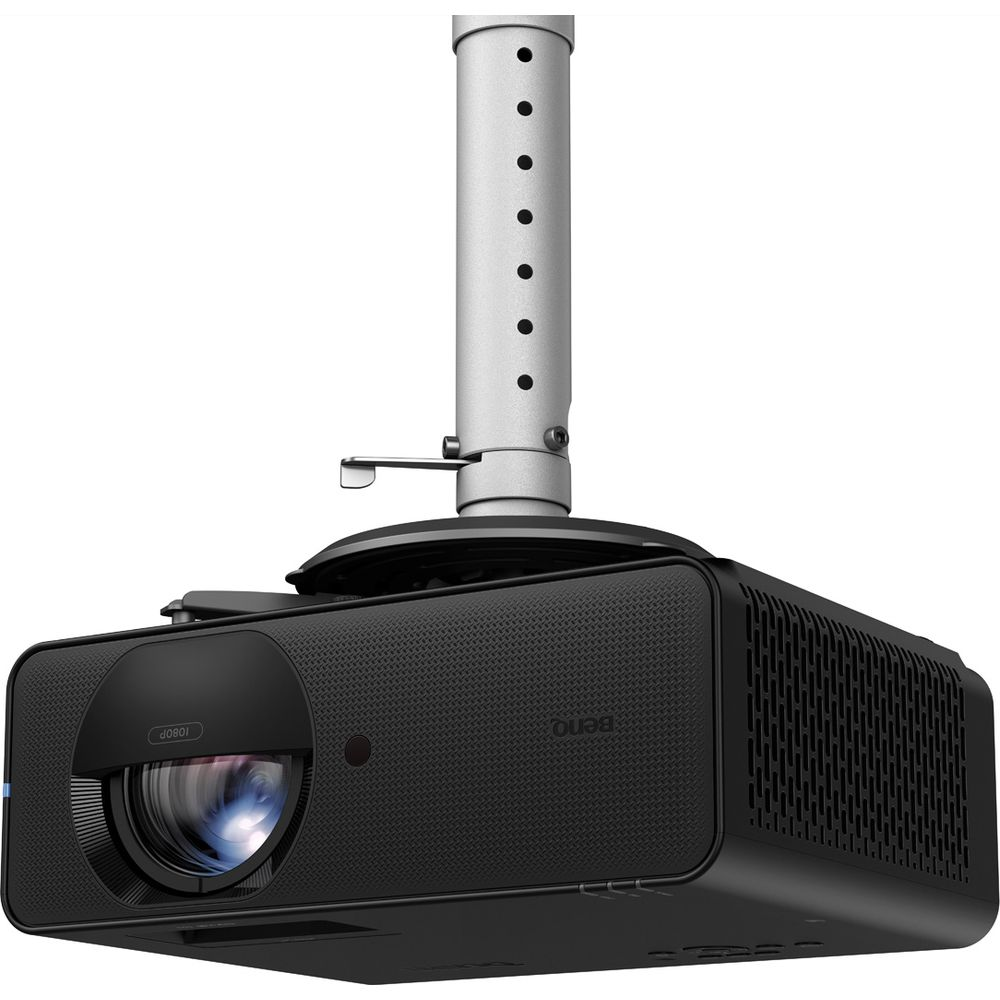 Projecteur noir monté au plafond avec support argenté et objectif visible.
