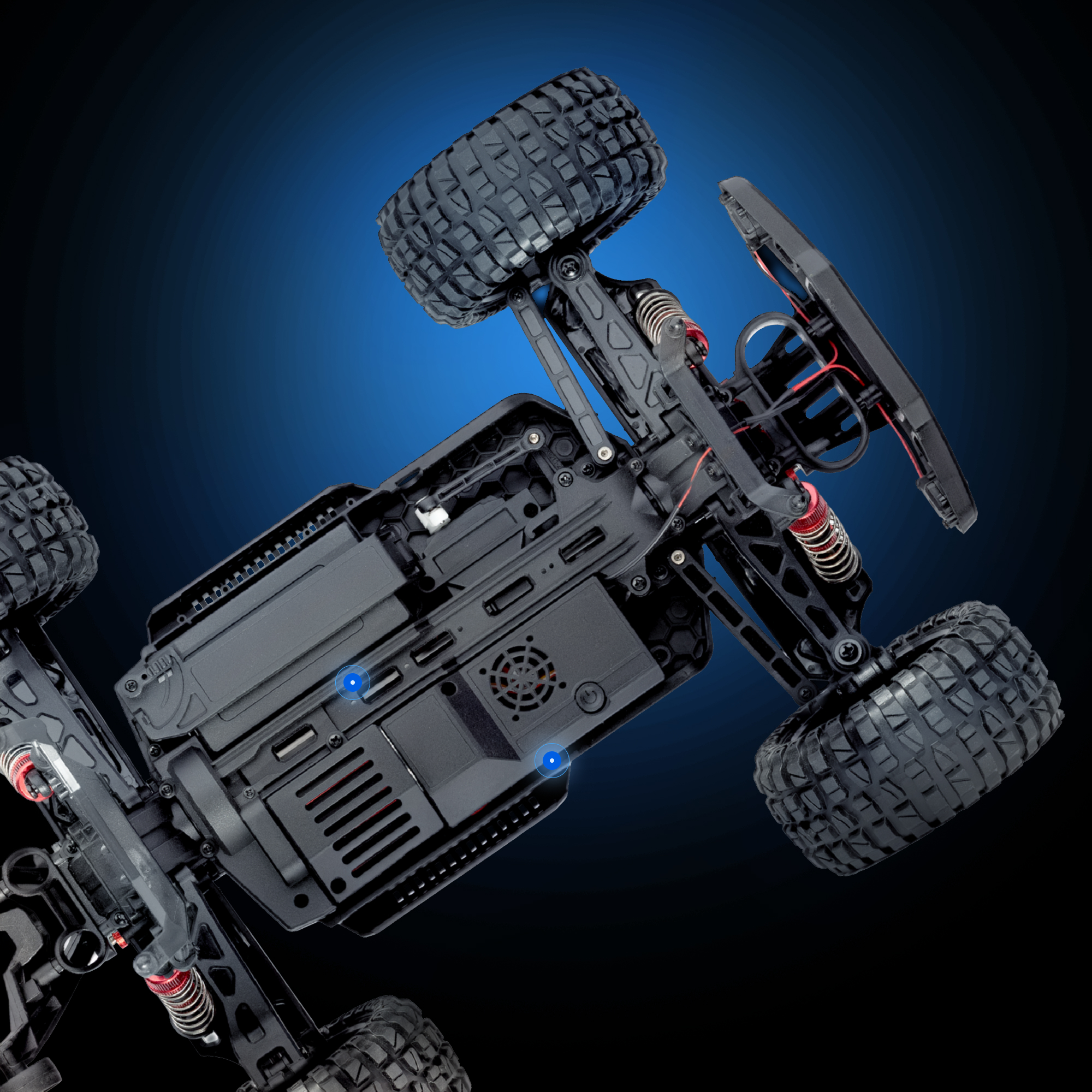 Schwarzes ferngesteuertes Autochassis mit großen Reifen und roten Stoßdämpfern.