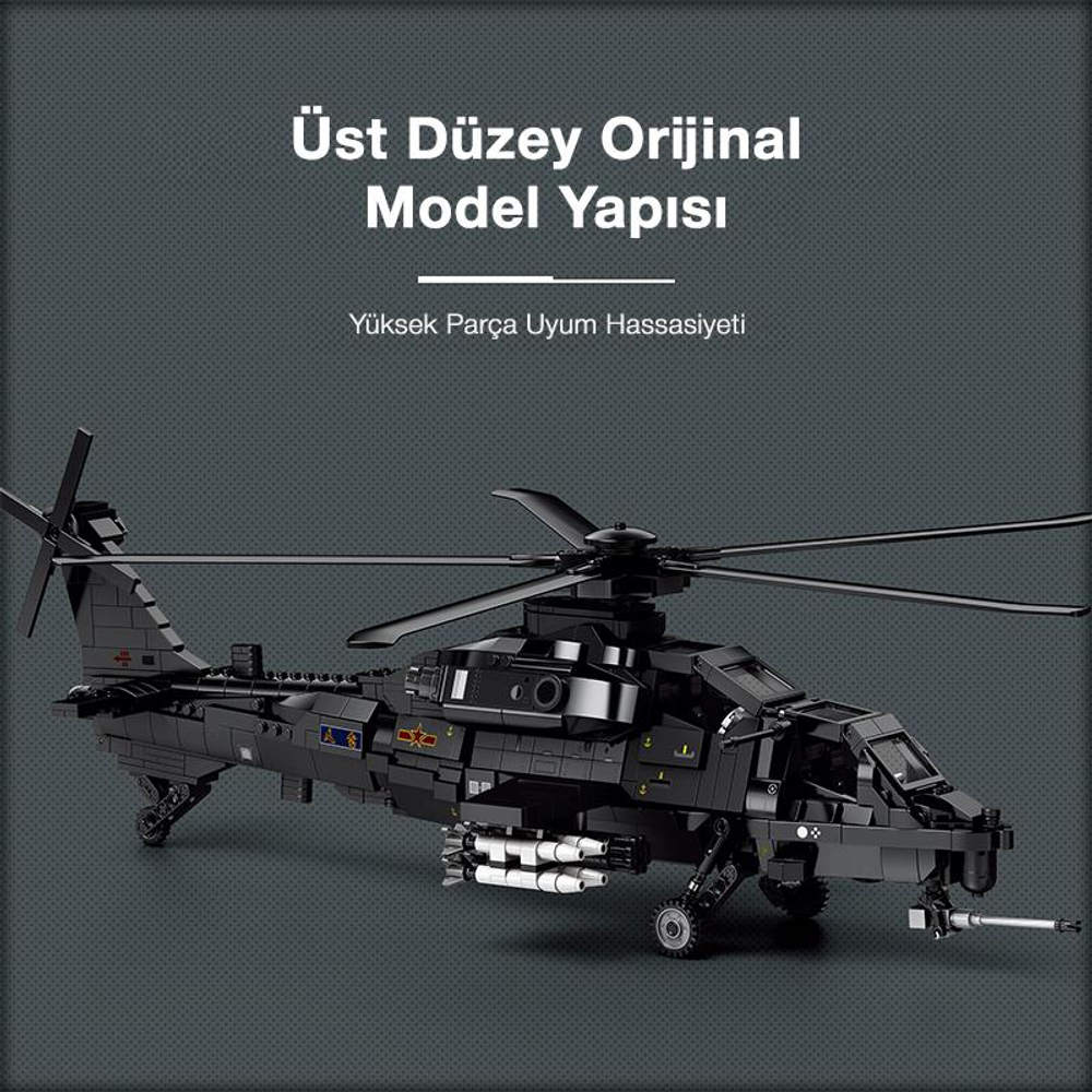 Füzeli siyah bir taarruz helikopteri modeli, gri arka plan üzerinde.