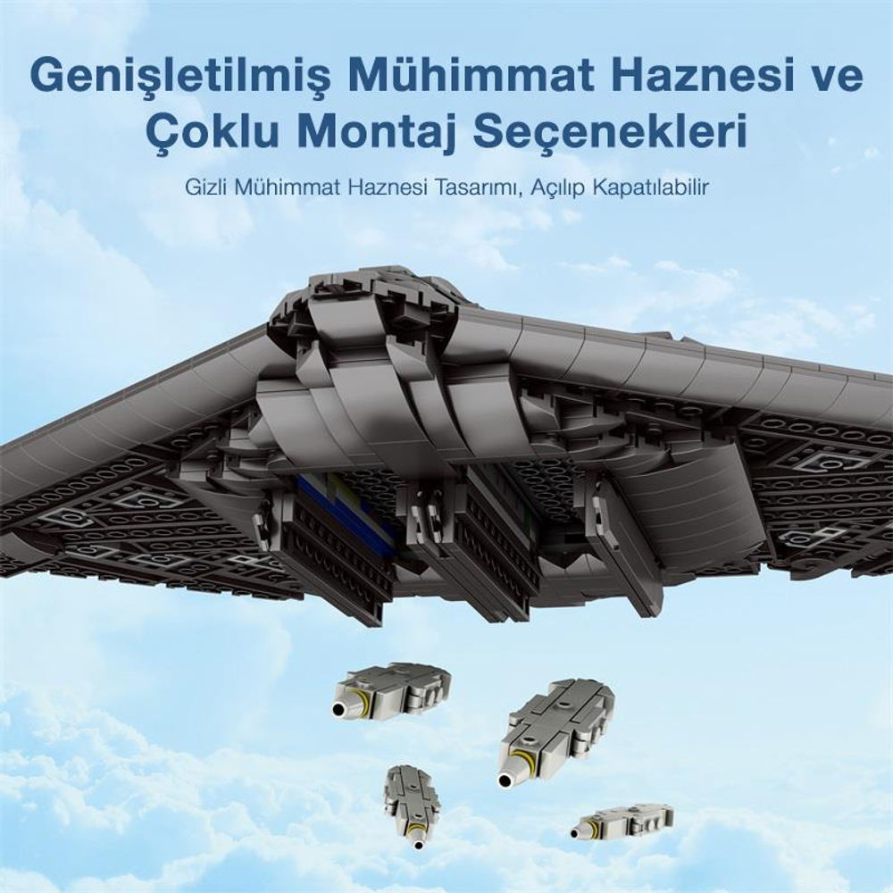 Gökyüzünde dört küçük podu olan gri oyuncak uçak modeli.
