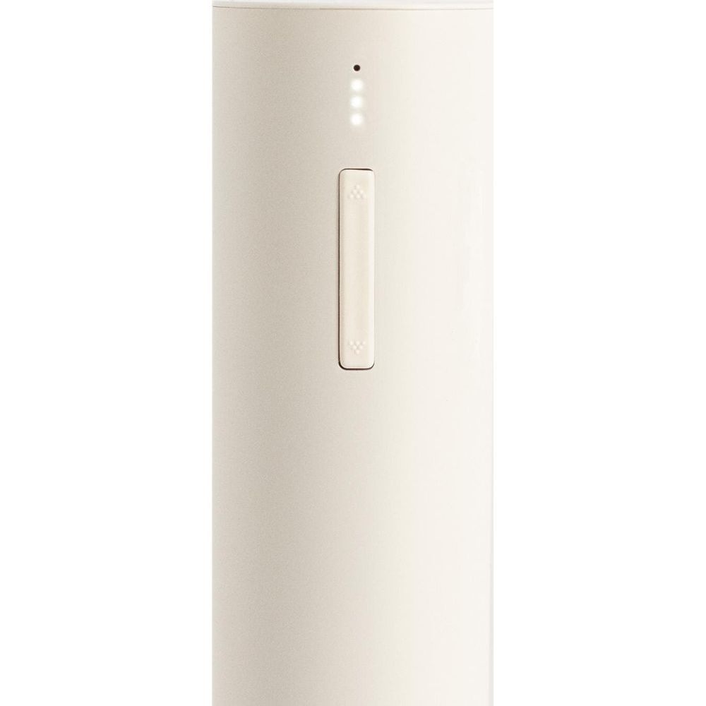 Un cilindro beige claro con una ranura vertical y cuatro luces indicadoras.