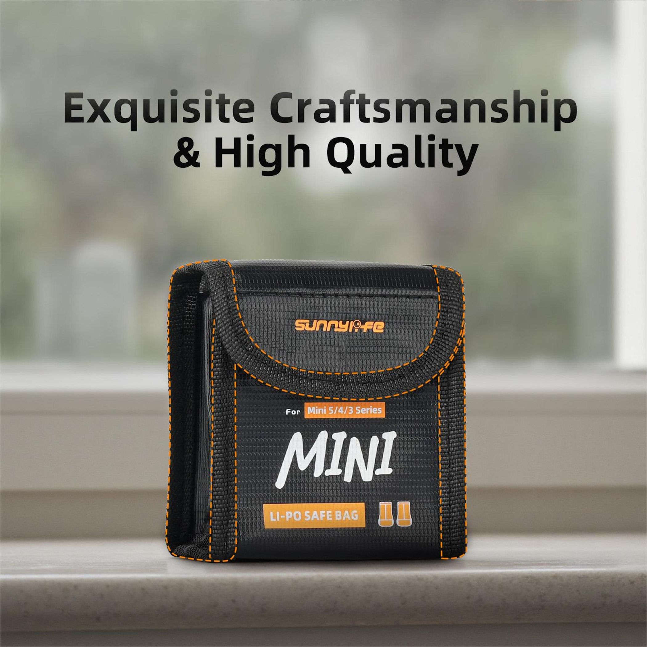 Schwarze Li-Po-Sicherheitstasche für Mini 5/4/3 Serie mit orangefarbenen Nähten.