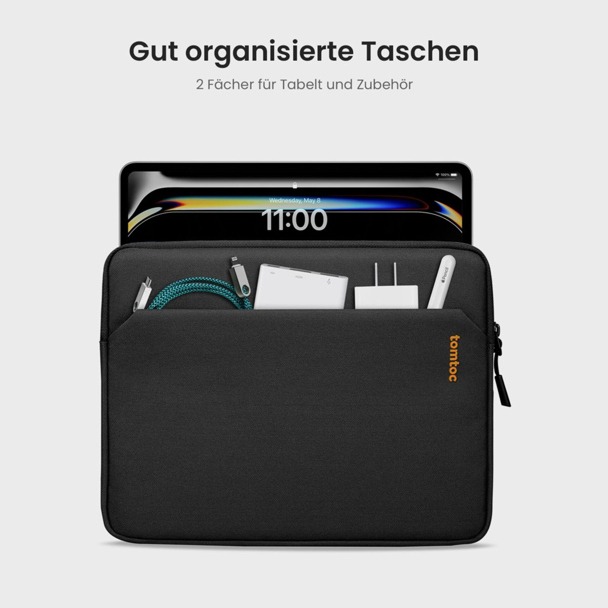 Schwarze tomtoc Tasche mit Tablet, Kabeln, Ladegerät u. Stift. Bildschirm zeigt 11:00.