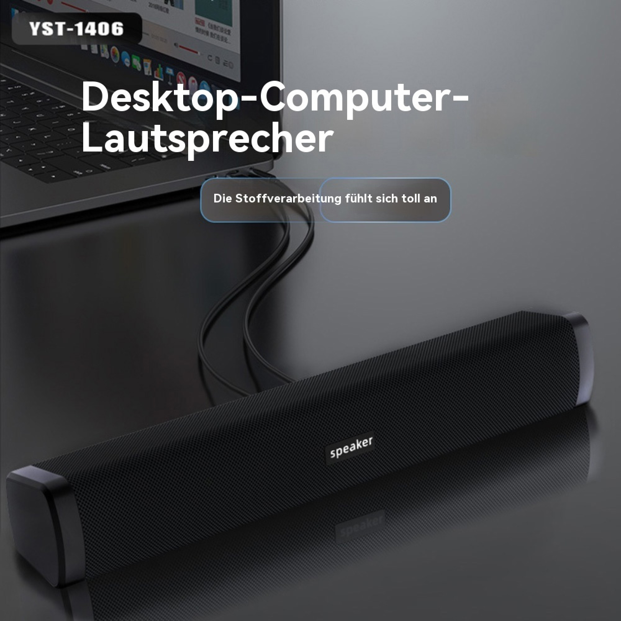 Schwarzer Desktop-Lautsprecher vor einem Laptop mit Kabelverbindung.