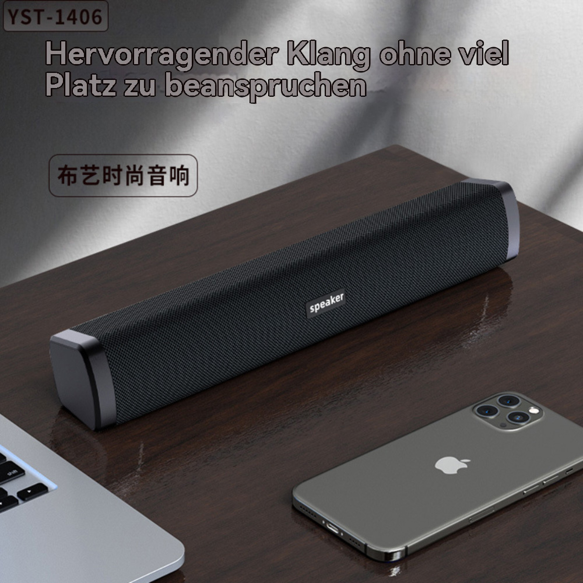 Schwarzer Lautsprecher mit Laptop und Handy auf Holztisch.