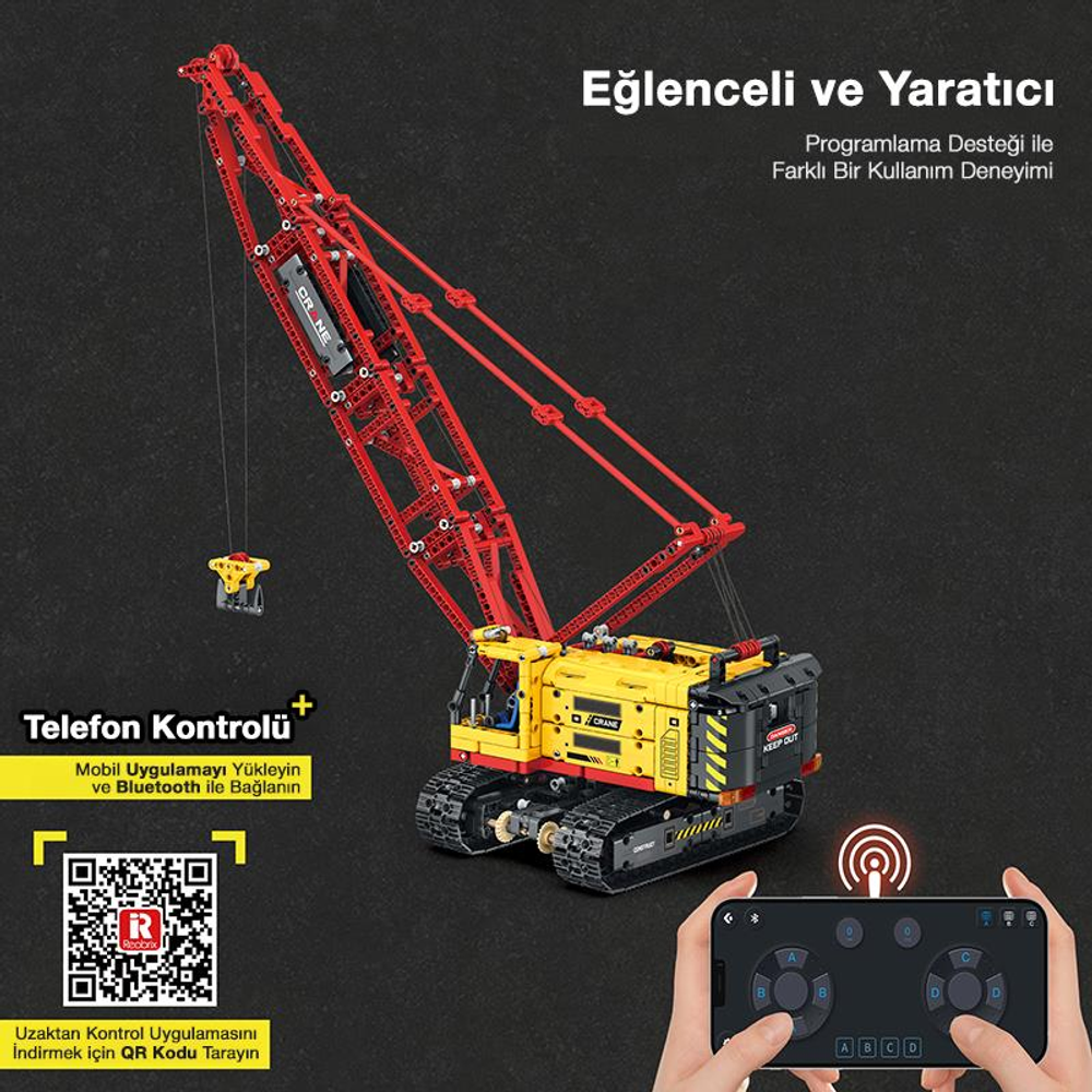 Sarı ve kırmızı vinç yapım seti uzaktan kumanda ile gösteriliyor.