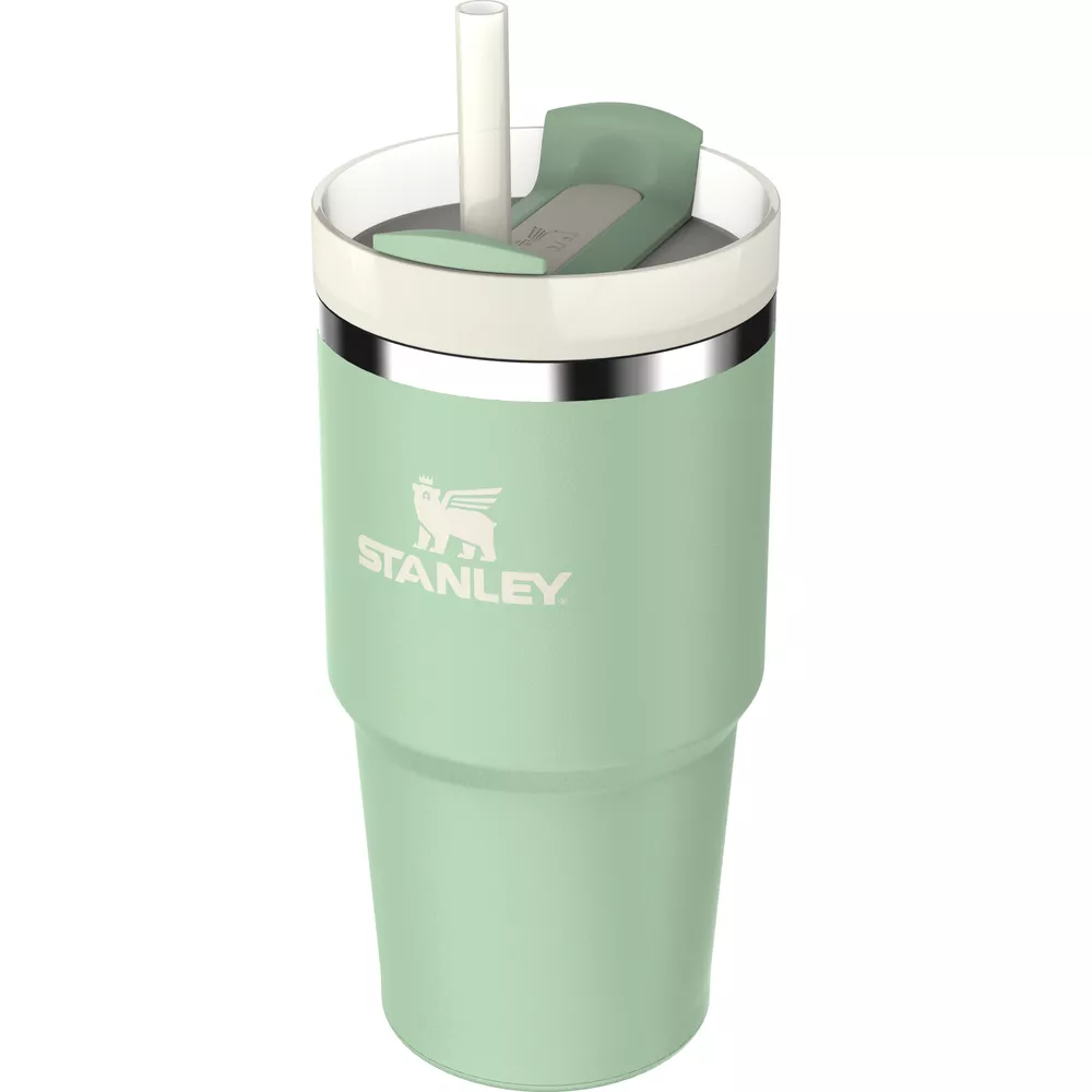 Beyaz pipet ve kapaklı açık yeşil Stanley bardağı.