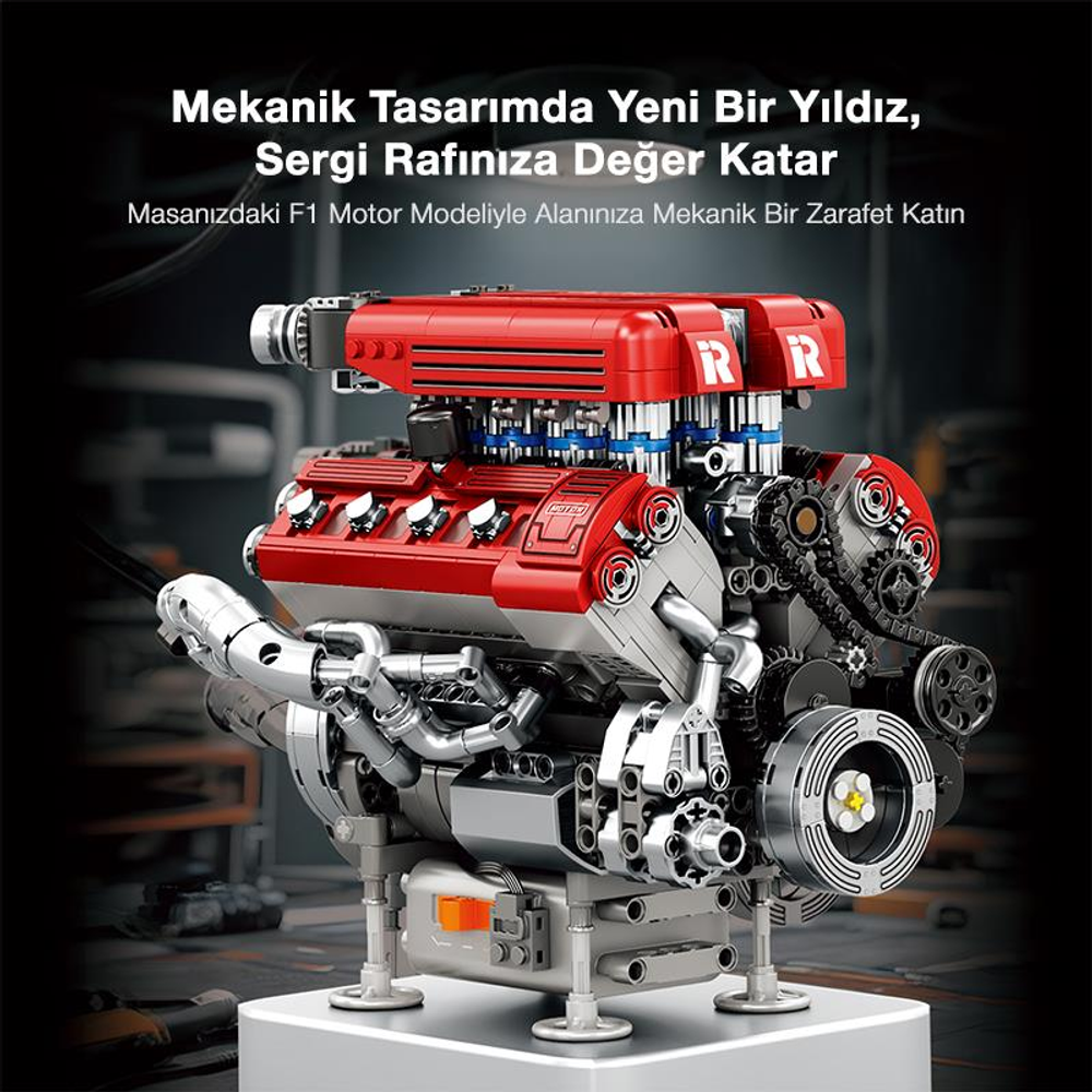 Kırmızı ve gümüş F1 motorunun detaylı modeli bir stant üzerinde sergileniyor.