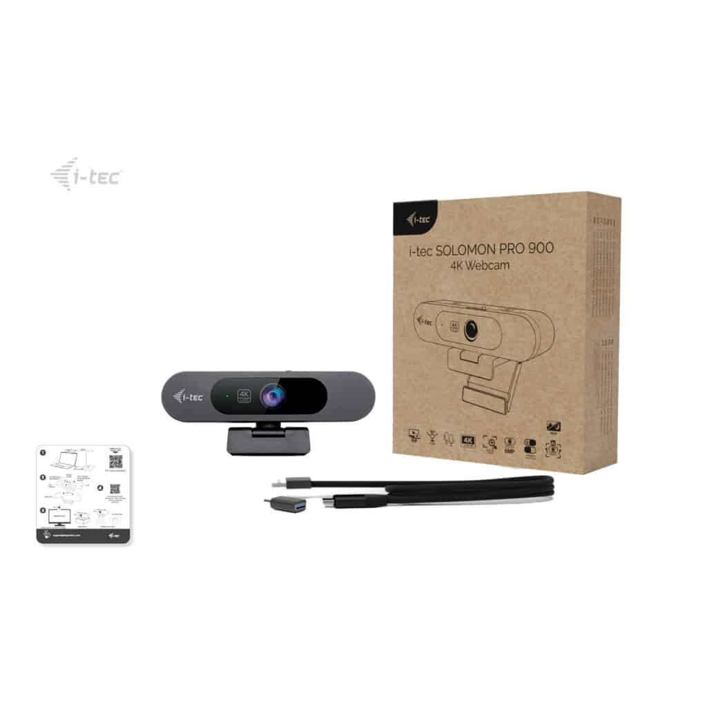 Una webcam i-tec 4K grigia con accessori e confezione su sfondo bianco.