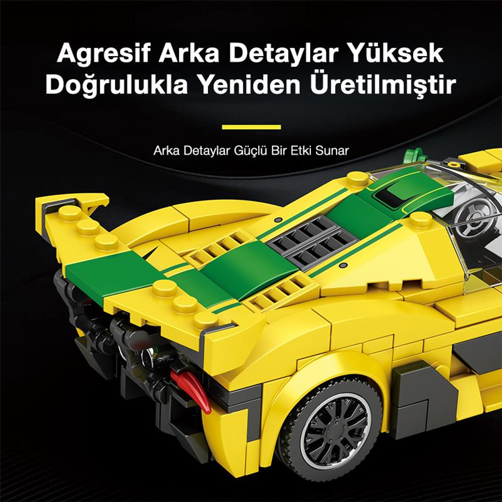 Detaylı arka ve siyah tekerlekli sarı ve yeşil Lego araba.