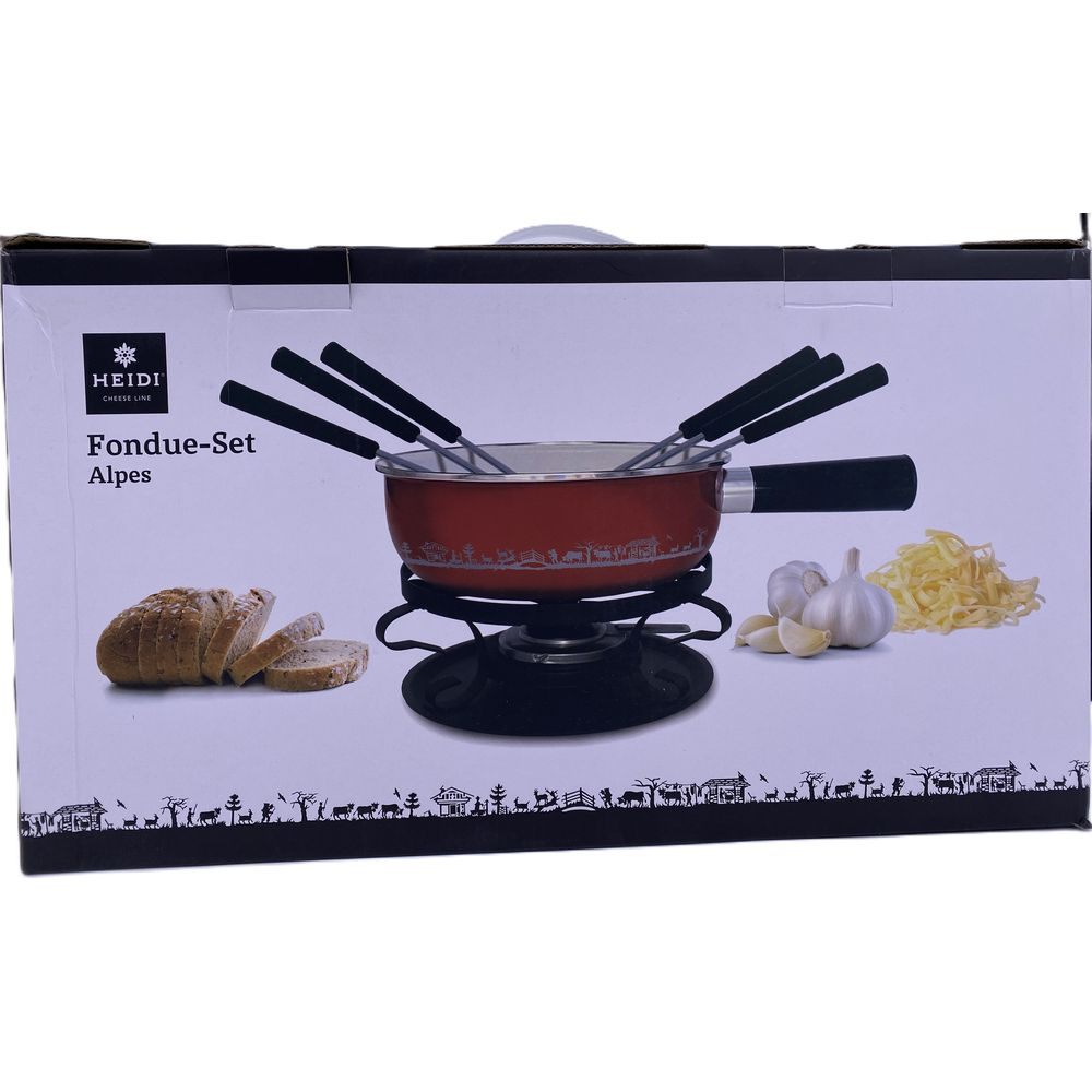 Ein rotes Fondue-Set mit Gabeln, Brot, Knoblauch und Käse auf einer Packung.
