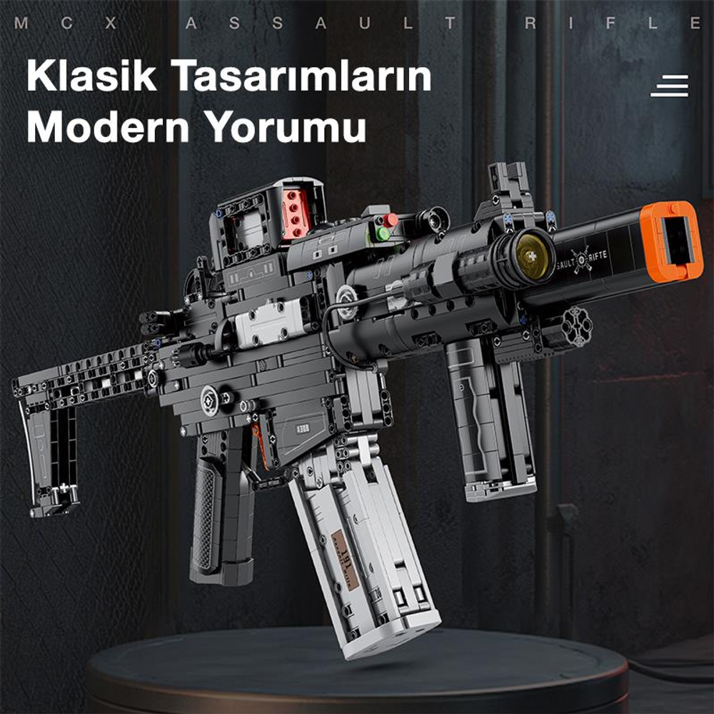 Turuncu namlu ucu frenli detaylı siyah oyuncak taarruz tüfeği.