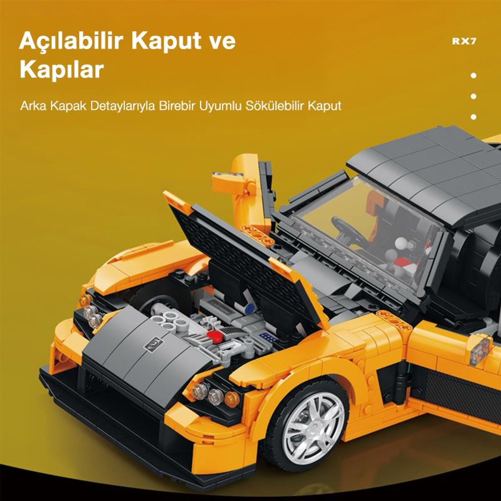 Turuncu ve siyah oyuncak spor araba, açık kapı ve kaput, motor detayları görünüyor.