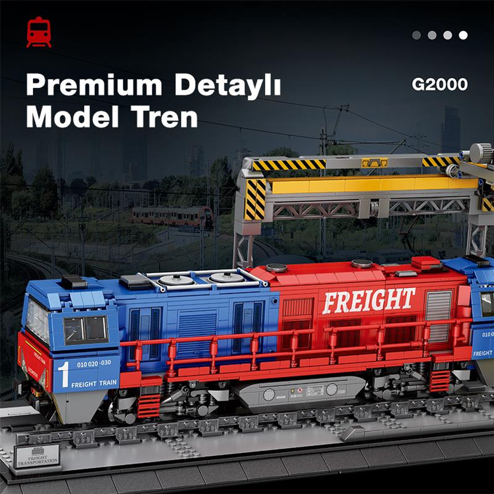 Raylar üzerinde "FREIGHT" yazılı mavi ve kırmızı model yük treni.