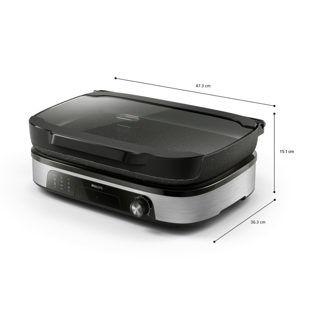 Grill elektryczny z szklaną pokrywą, srebrną podstawą i czarnym panelem sterowania.
