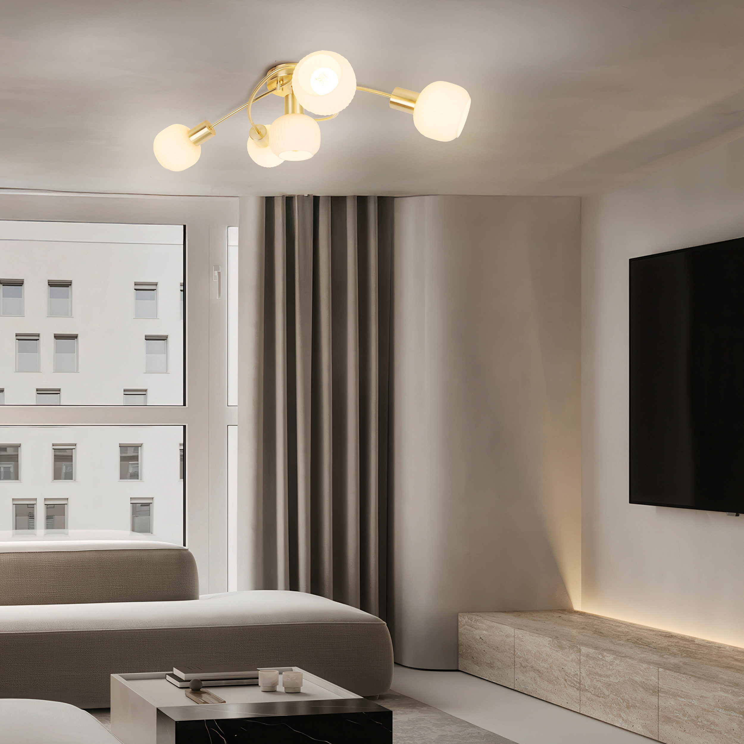 Ein modernes Wohnzimmer mit einem Sofa, einem Couchtisch, einem Fernseher und einem Fenster.
