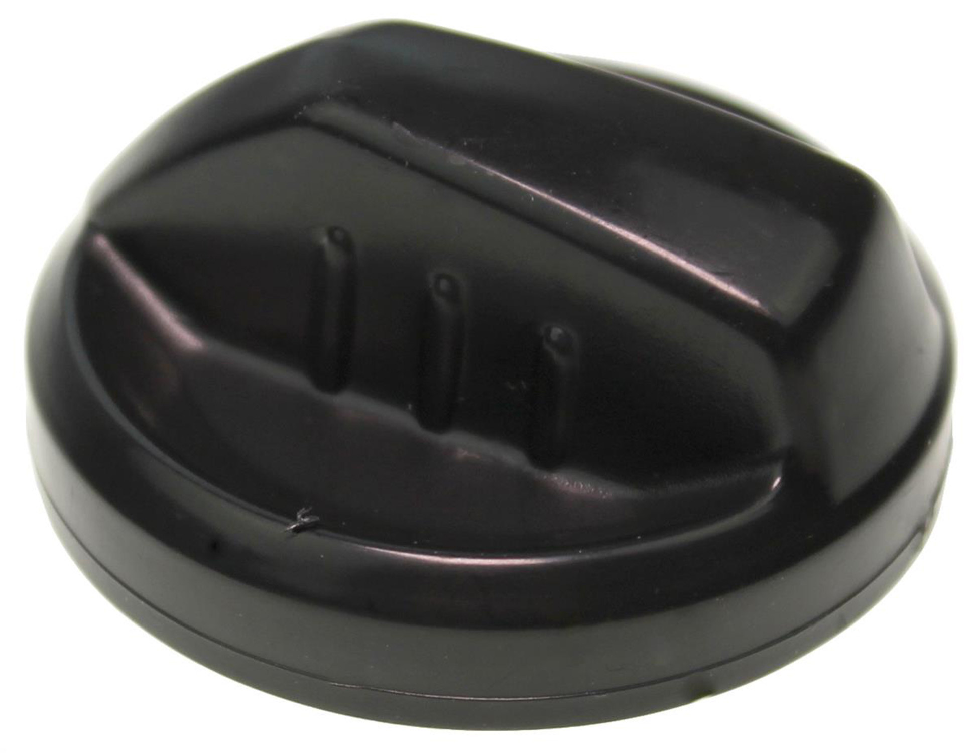 Ein glänzender schwarzer Plastikdeckel mit Rillen oben.