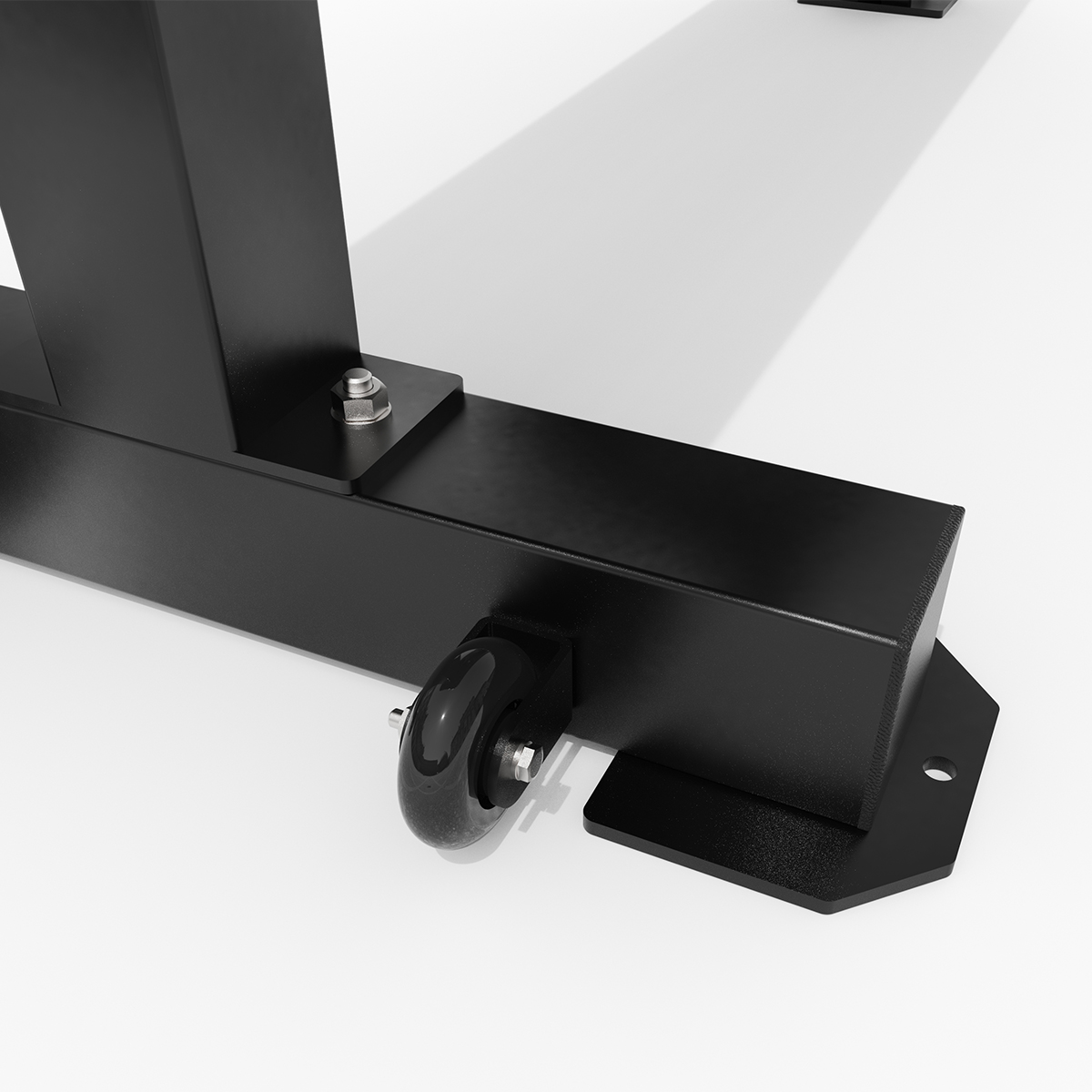 Estructura de metal negra con rueda y pernos sobre fondo blanco.