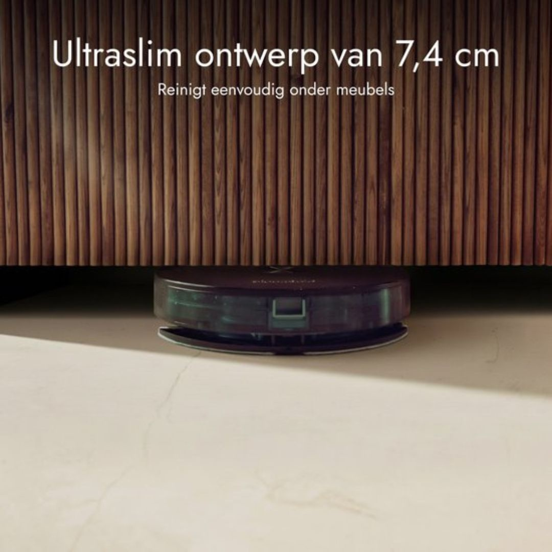 Slim robot vacuum cleaning under a wooden cabinet on a light-colored floor.
