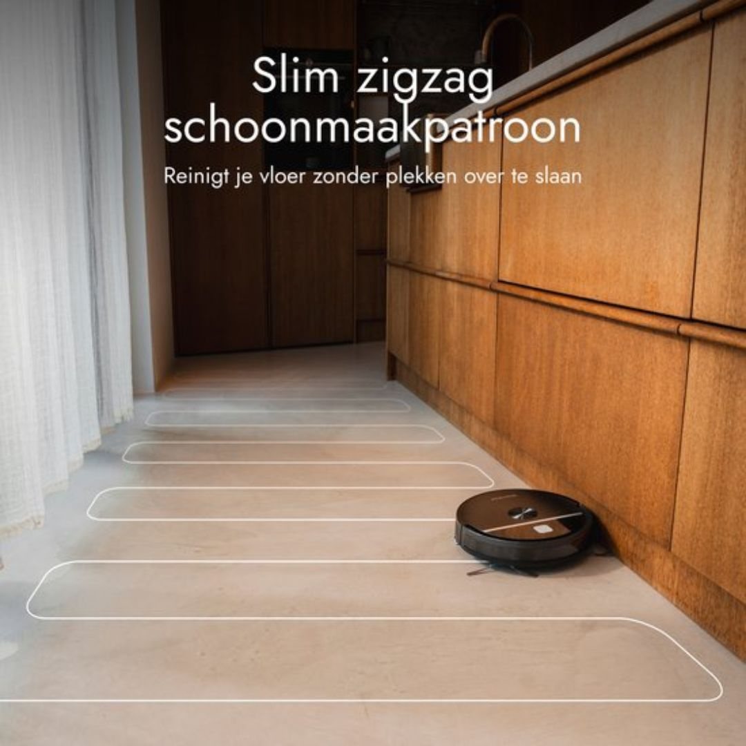 A robot vacuum cleans a light floor in a zigzag pattern.