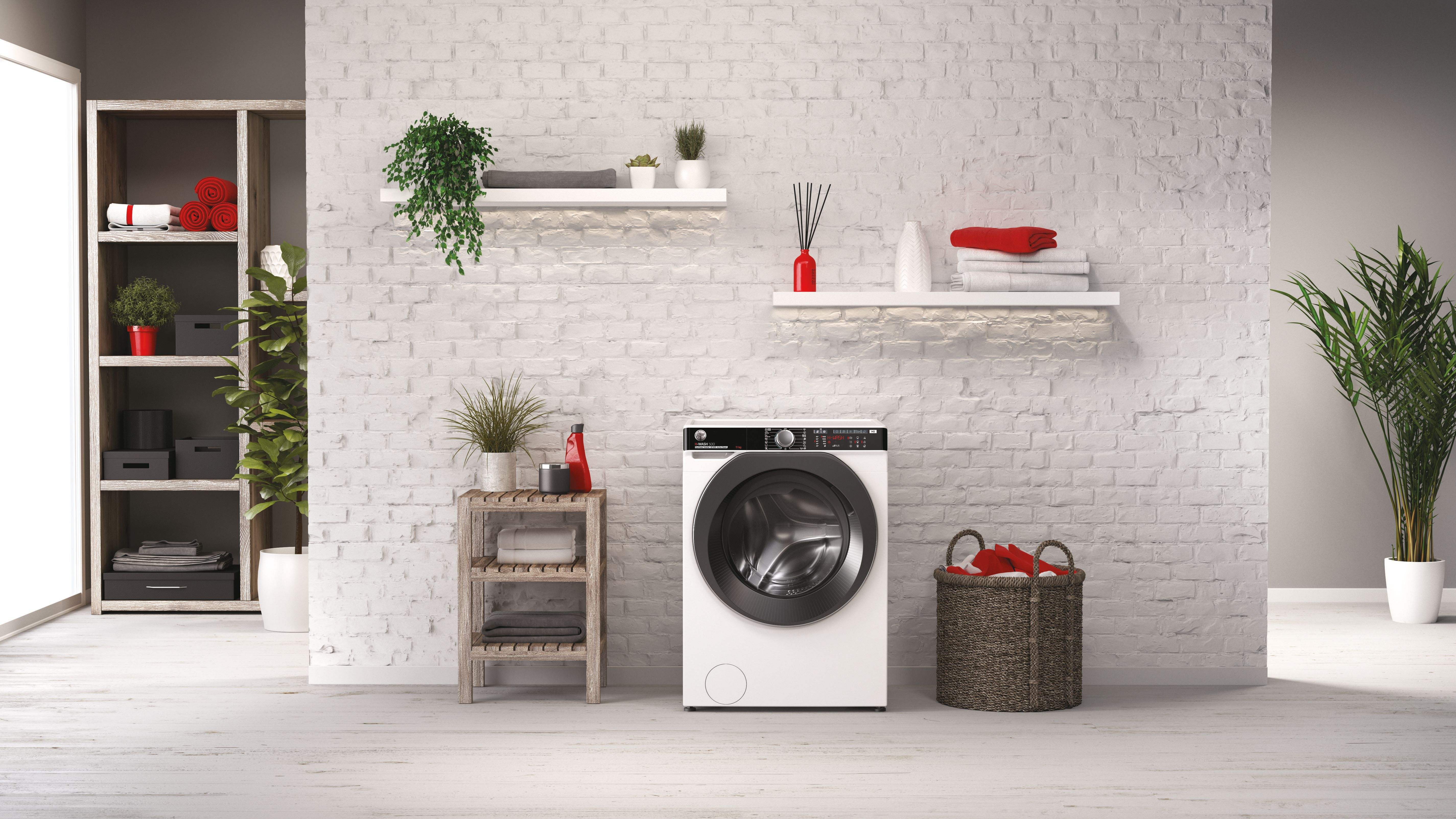Une buanderie avec une machine à laver blanche, des étagères et un panier à linge.