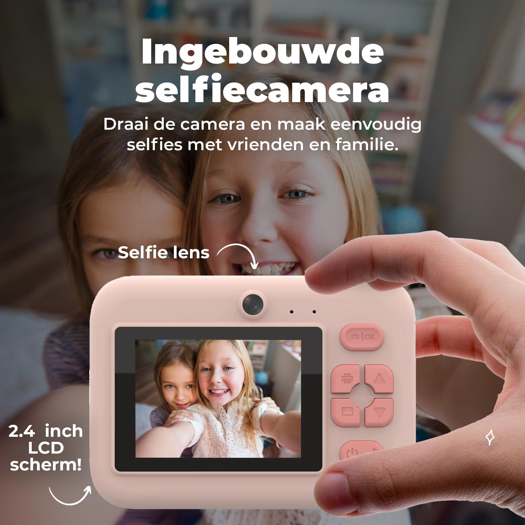 A pink camera with an LCD screen showing two girls taking a selfie.
