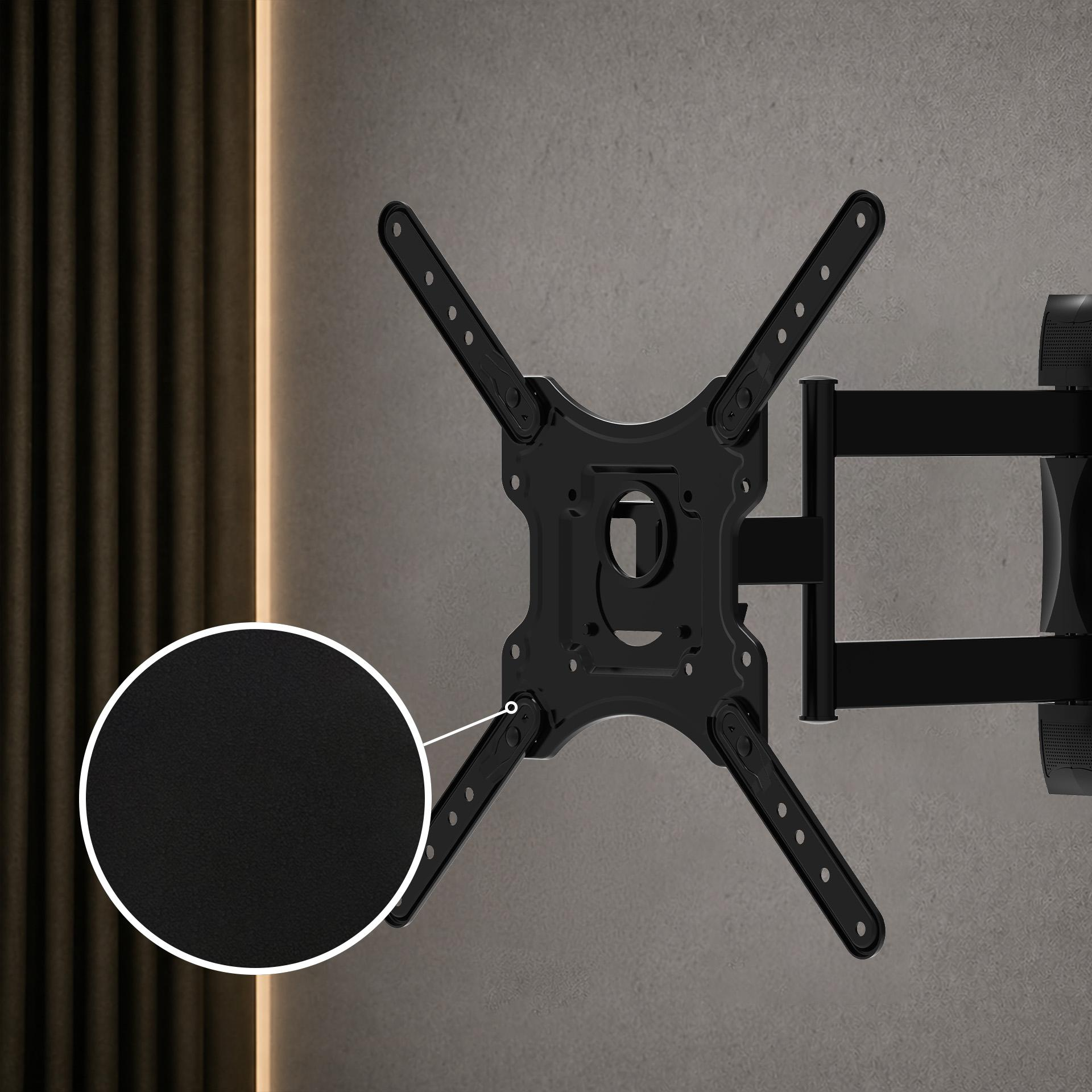 Supporto da parete TV nero con bracci estensibili su muro grigio.