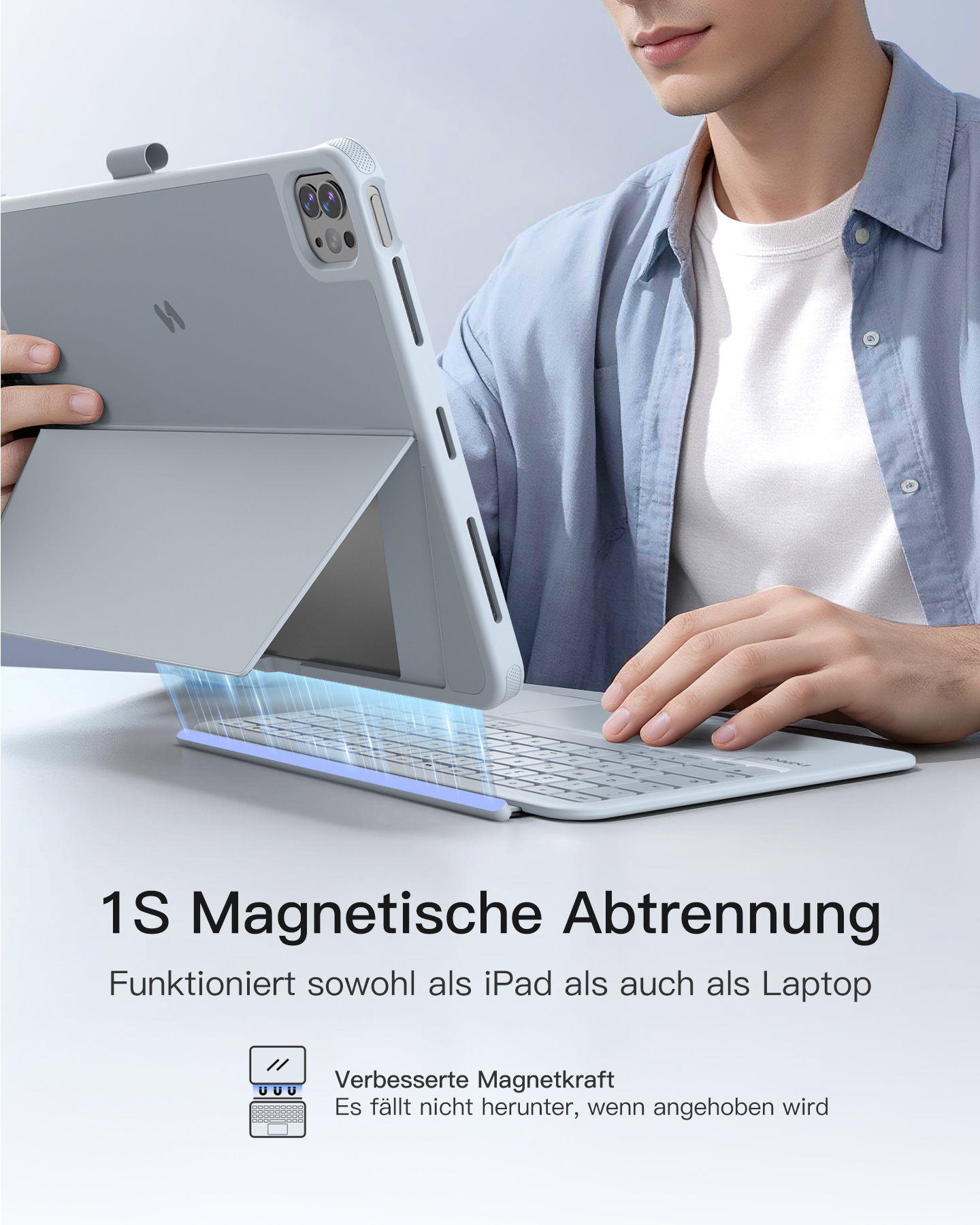Mann hält ein hellgraues iPad mit Tastatur. Es ist magnetisch befestigt.