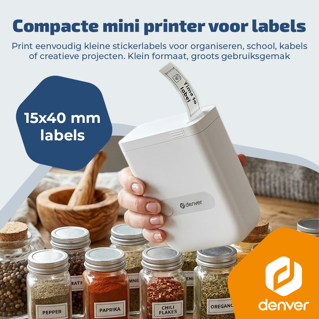 A white label printer held by a hand, surrounded by spice jars.