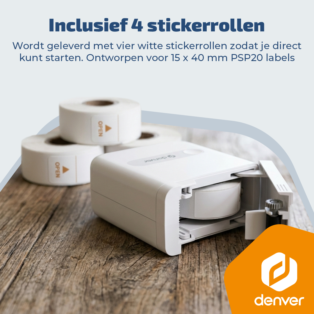 A white label printer with four rolls of white labels on a wooden surface.