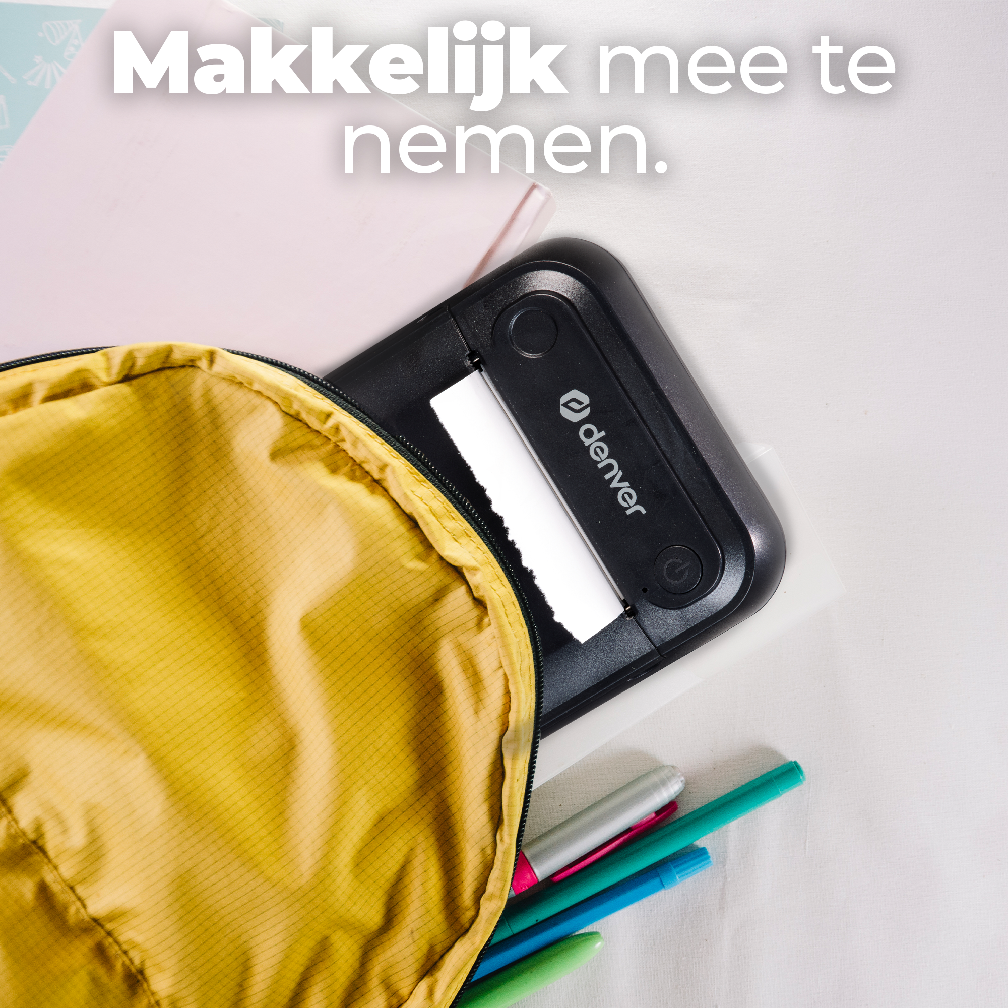 A yellow backpack opens to reveal a black printer and pens.