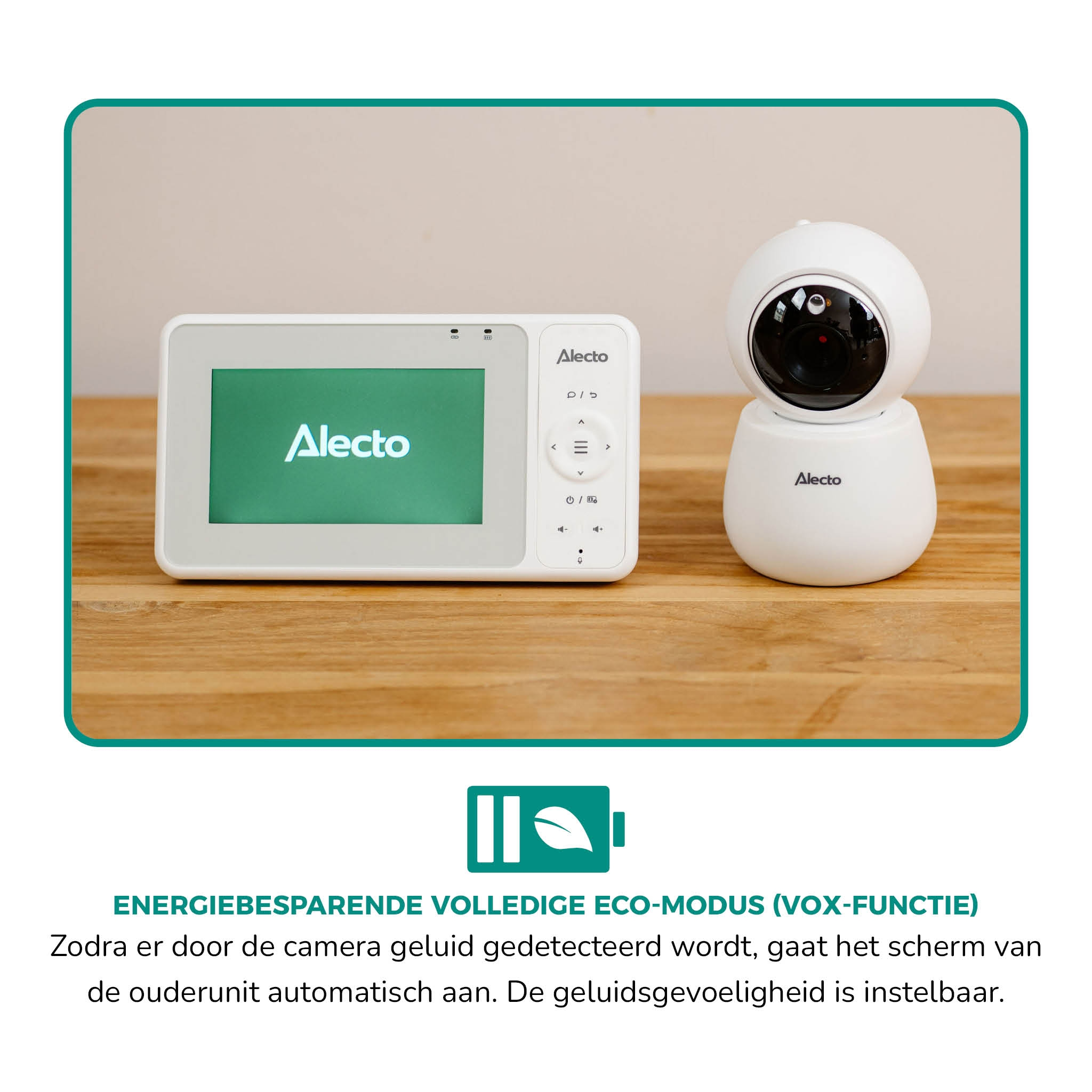 A white baby monitor and camera unit on a wooden surface.