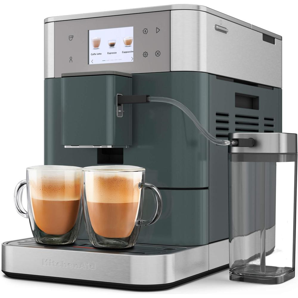 Eine Küchenmaschine mit zwei Tassen Kaffee und einem Wassertank.