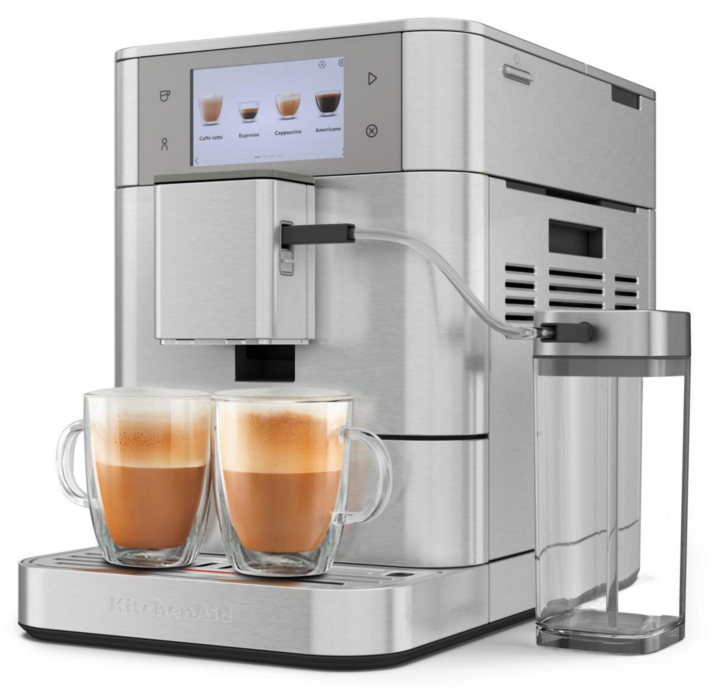 Zilveren koffiemachine met twee koppen espresso en melkreservoir.