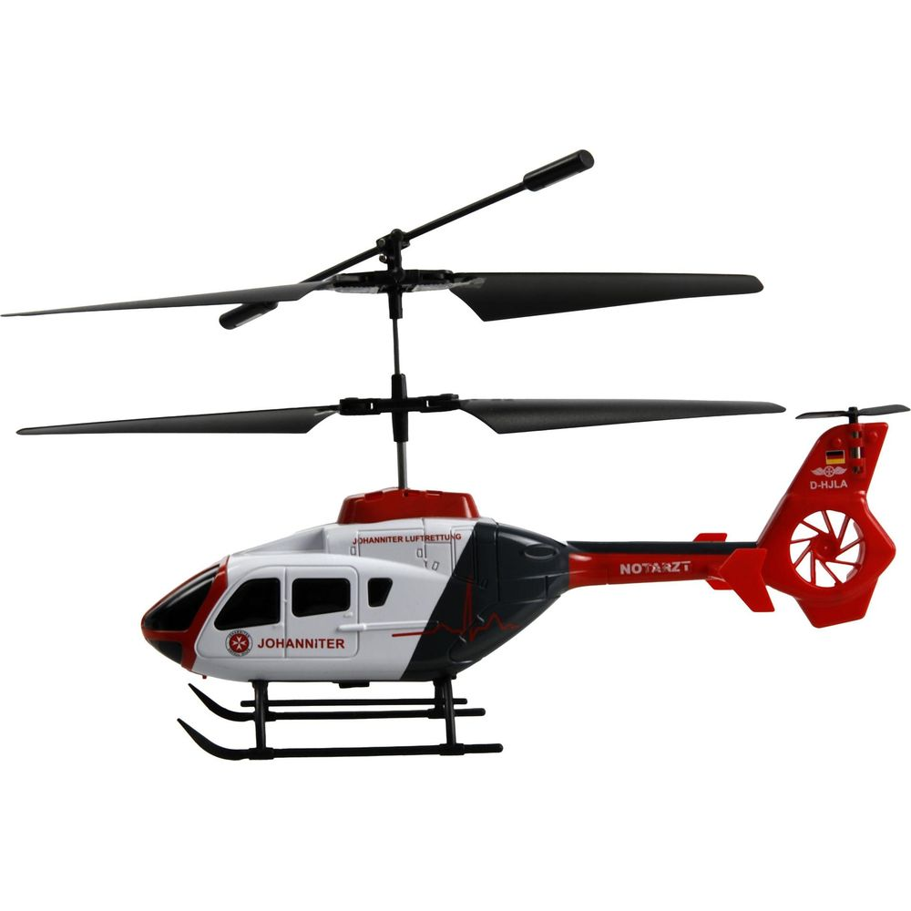 Ein roter und weißer Spielzeughubschrauber mit schwarzen Rotorblättern und der Aufschrift NOTARZT.