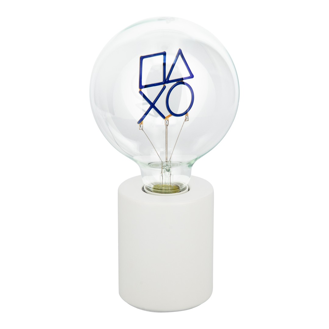 Żarówka z symbolami PlayStation na białej podstawie.