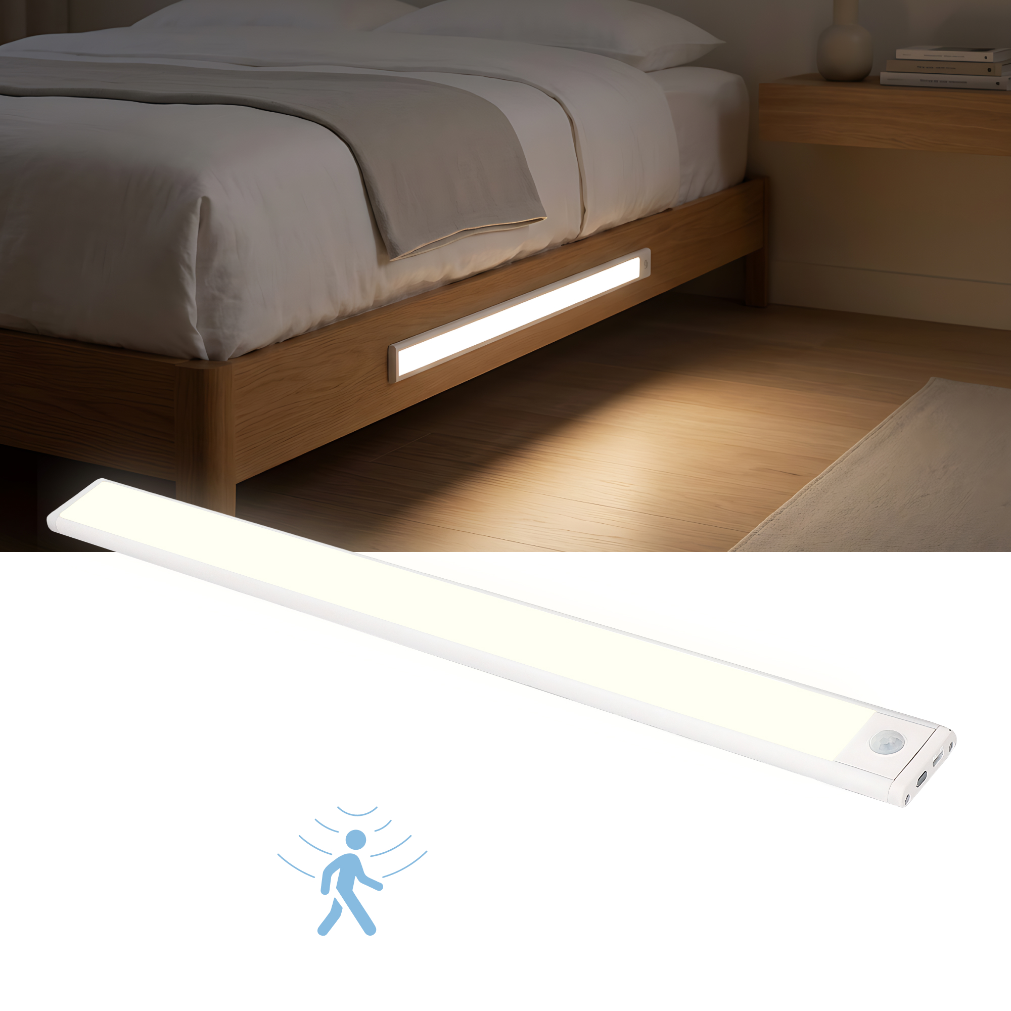 Una striscia LED bianca con sensore di movimento giace davanti a un letto.