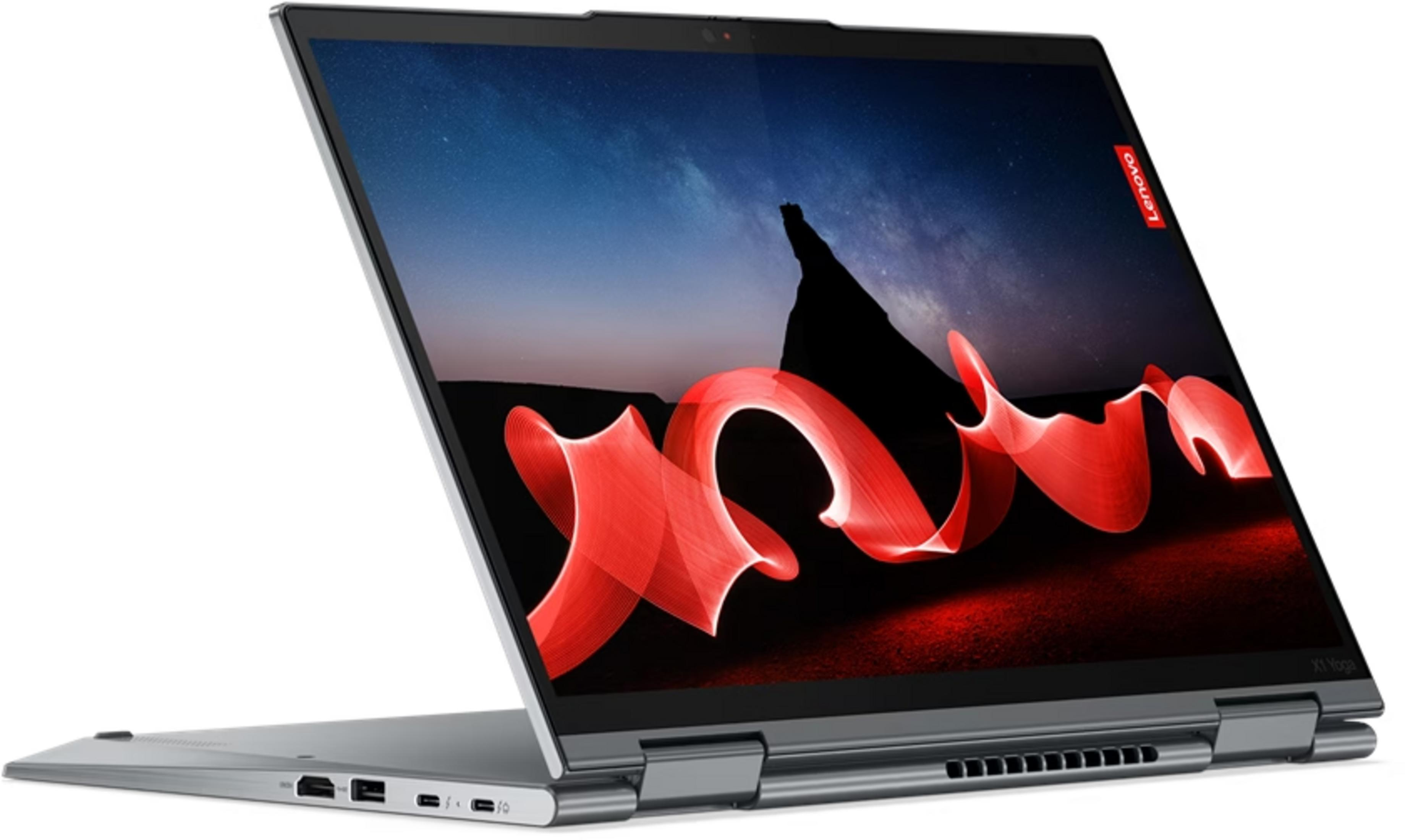 Un laptop Lenovo X1 Yoga argentato aperto, mostra uno sfondo di cielo stellato con arte astratta rossa.