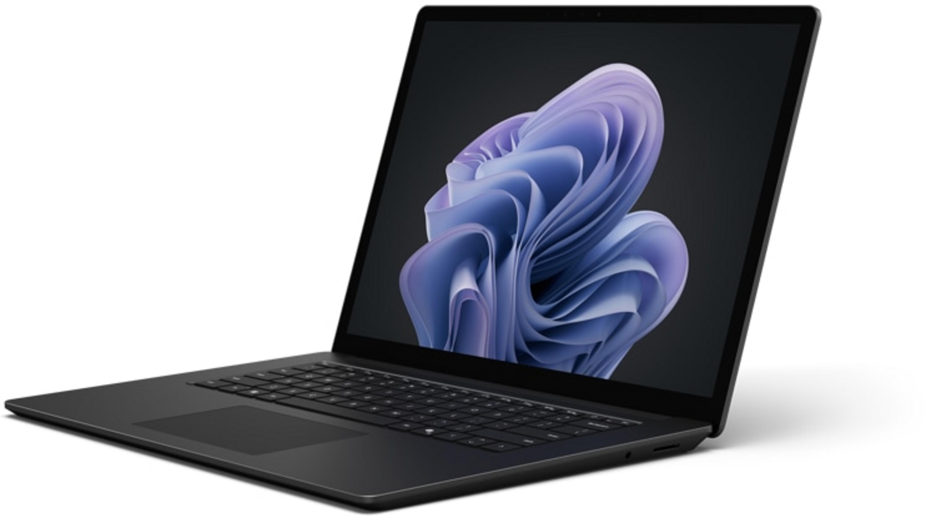 Schwarzer Laptop mit einem abstrakten, violetten Muster auf dem Bildschirm.