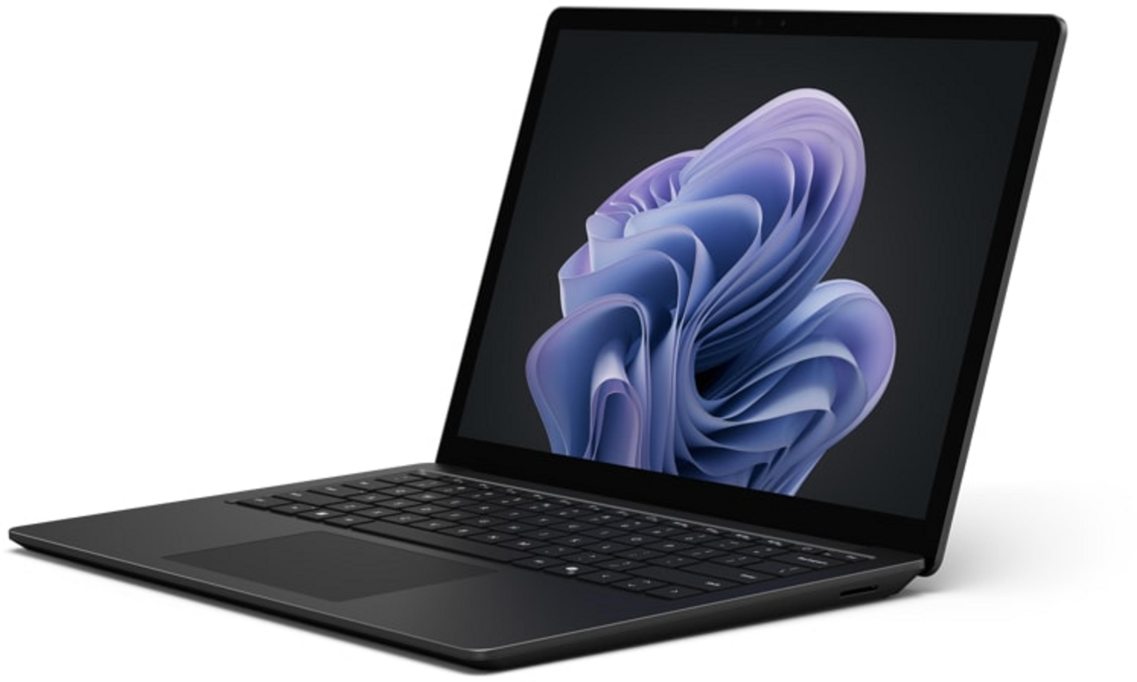 Ein schwarzer Laptop mit einem blauen, wirbelnden Hintergrundbild auf dem Bildschirm.