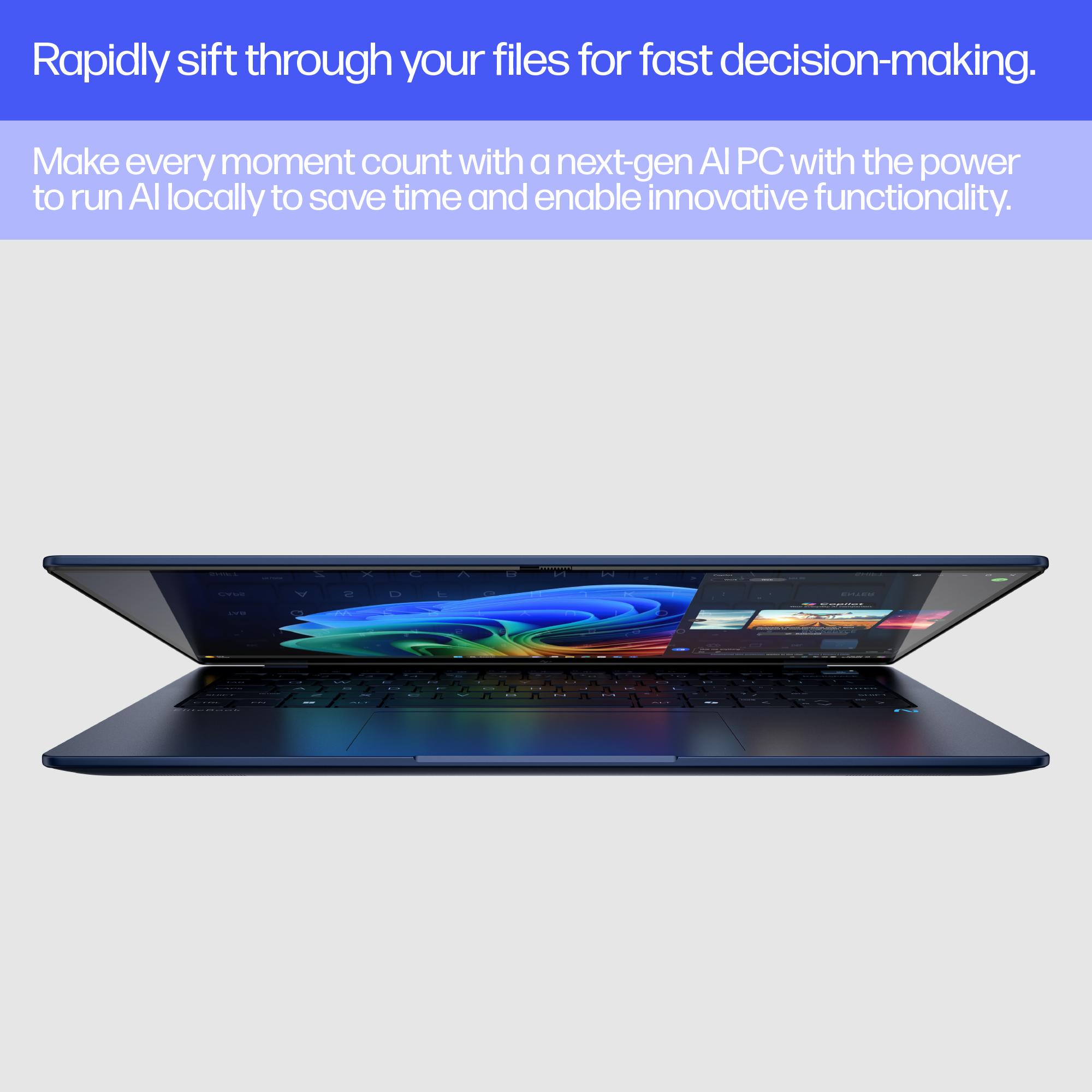 Ein geöffneter dunkelblauer Laptop mit leuchtendem Hintergrundbild und Tastatur.