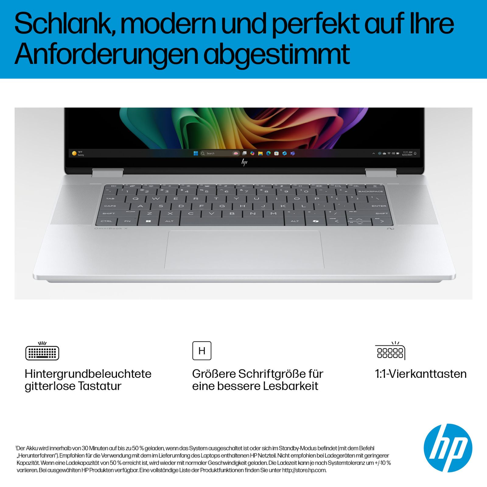 Srebrny laptop HP z podświetlaną klawiaturą i kolorową tapetą pulpitu.