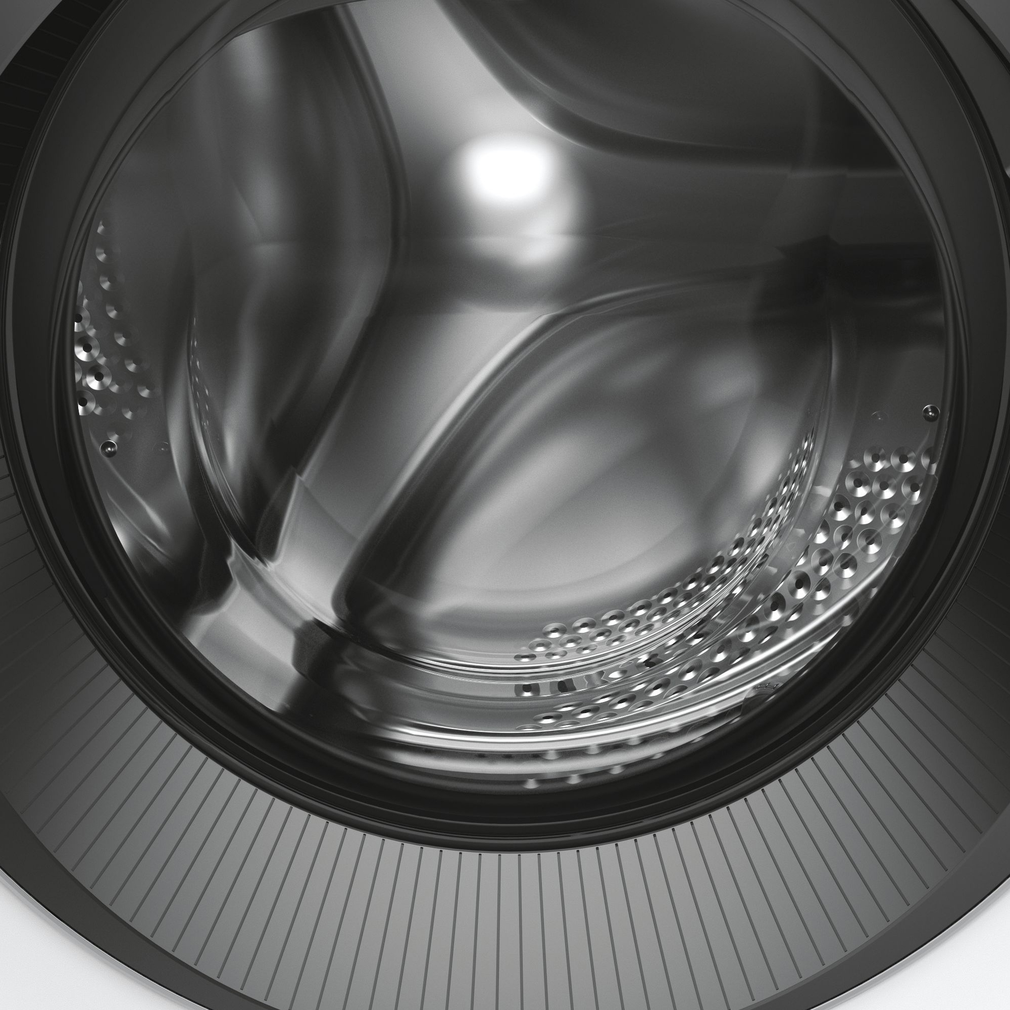 Innenansicht einer Waschmaschinentrommel mit Metalloberfläche und Perforationen.