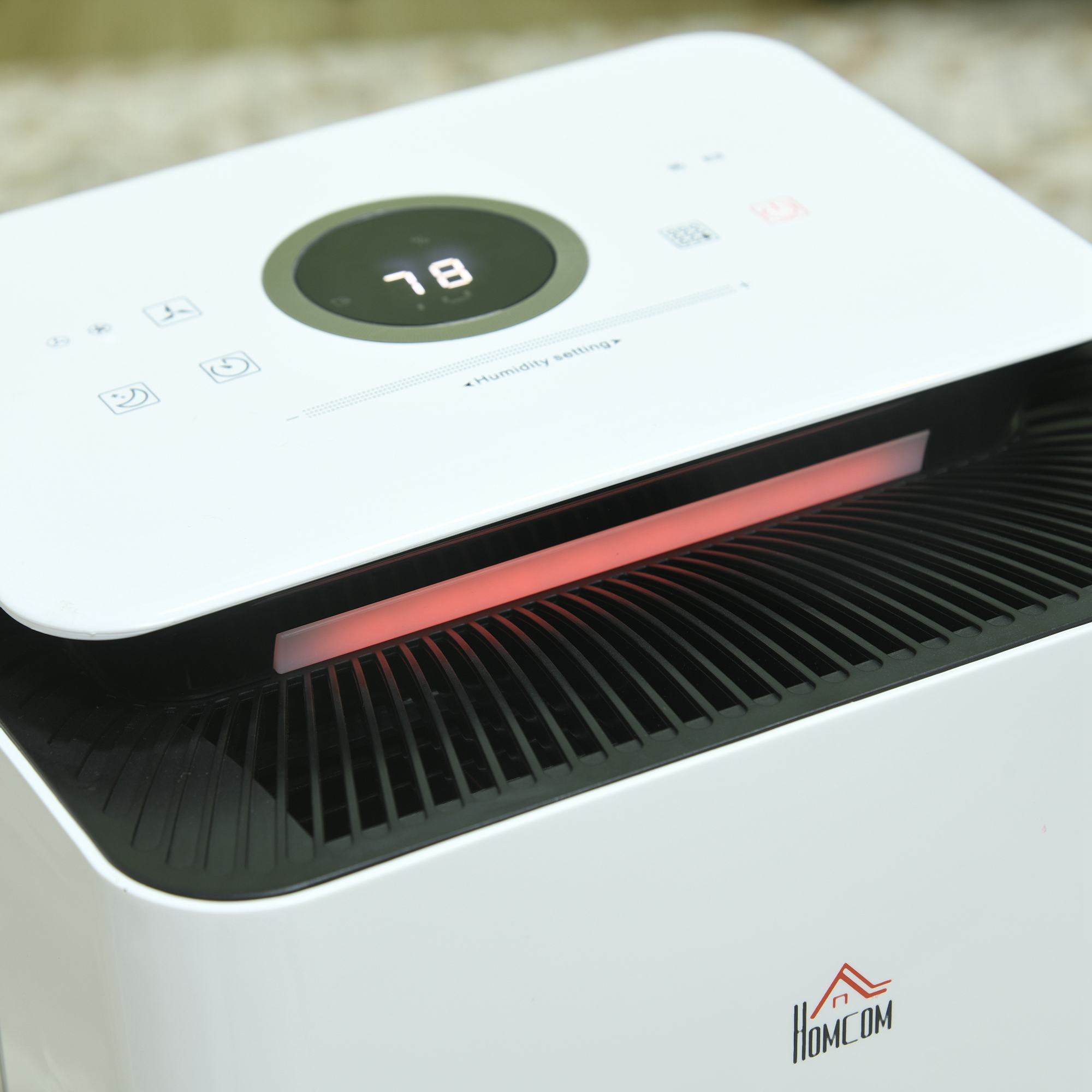 Un deumidificatore bianco con striscia luminosa rossa e display digitali.