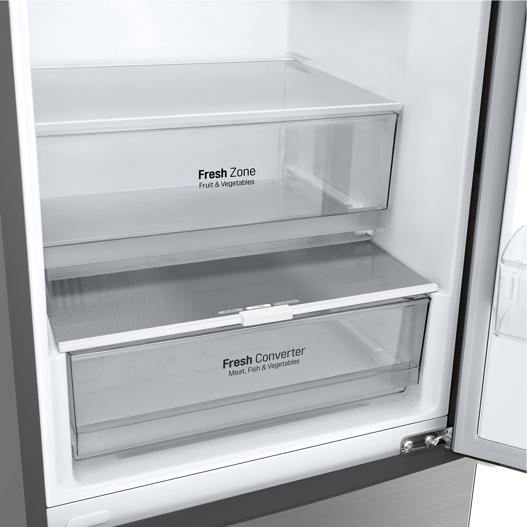 Interior de un refrigerador con dos cajones: uno para frutas y verduras, otro para carne.