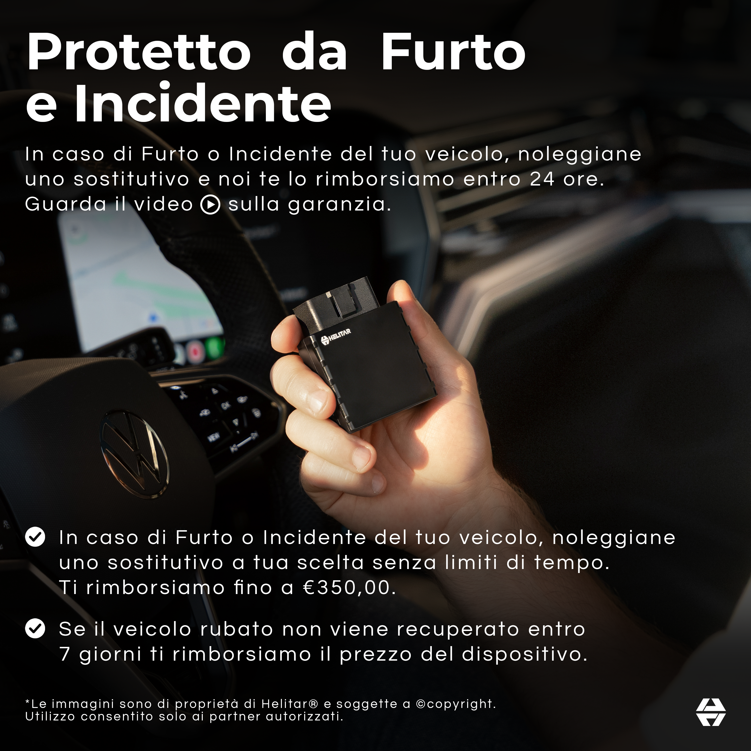 Un dispositivo nero tenuto nella mano di un uomo, con un volante in primo piano.