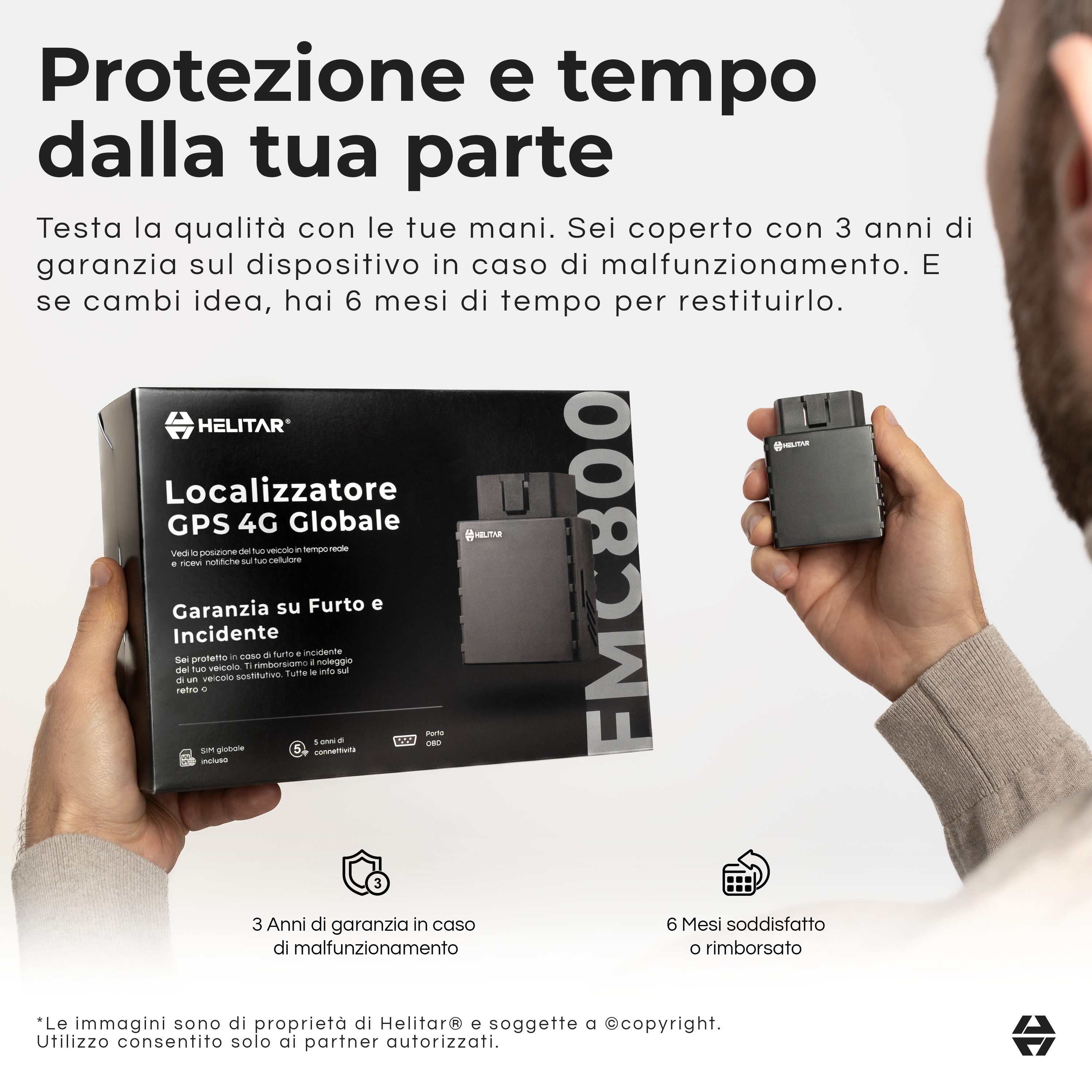 Un uomo tiene in mano un localizzatore Helitar GPS 4G nero.