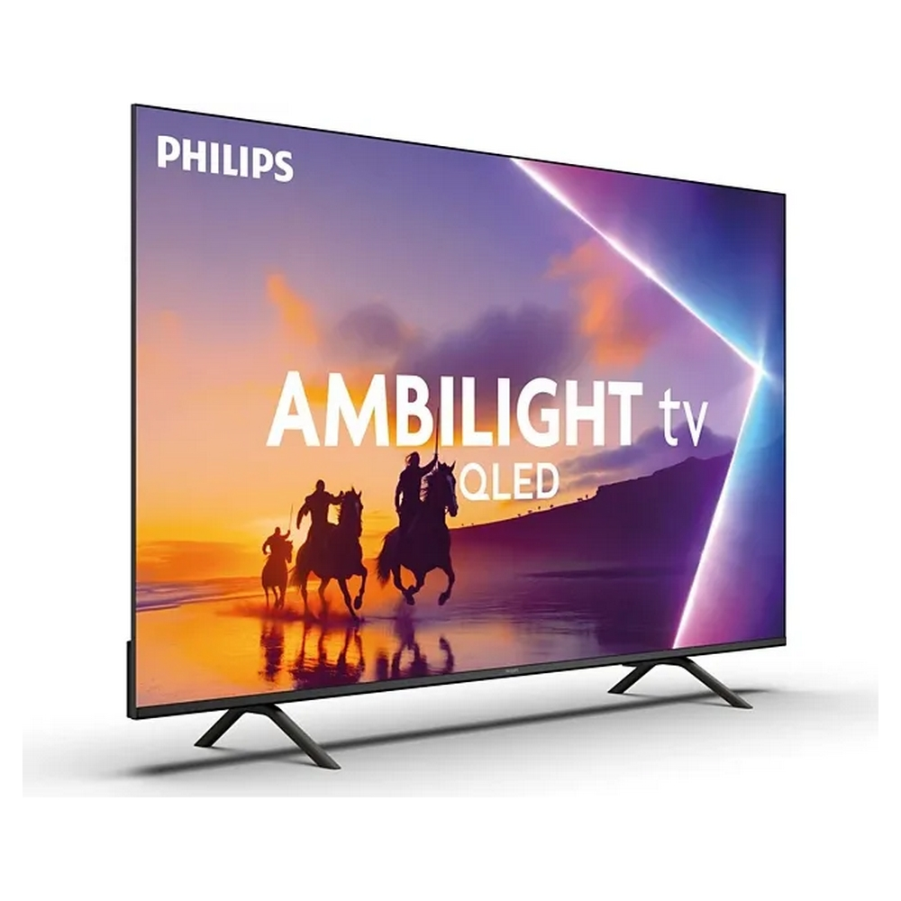 Un TV Philips Ambilight QLED mostra una scena di tre cavalieri su una spiaggia al tramonto.